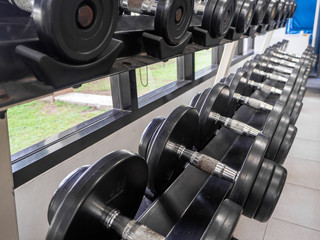Obraz premium dumbbell set. Close up many metal dumbbells