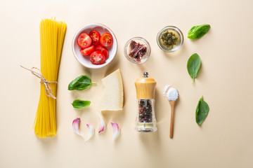 Raw spaghetti and ingredients flat lay