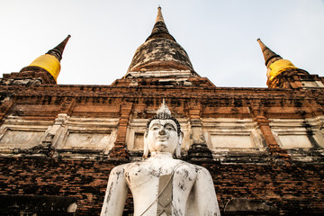 Fototapeta premium single Buddha statue inside Wat Yai Chai Mongkhon, a Buddhist temple of archaeological park, Ayutthaya, Thailand