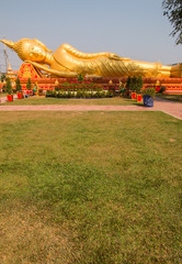 Fototapeta na wymiar Reclined Buddha statue near Pha That Luang, a landmark of Vientiane
