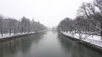 Winter view of the Isar river on the Ludwigsbrücke Bridge in Munich, Germany