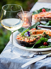 grilled salmon with salad and wine