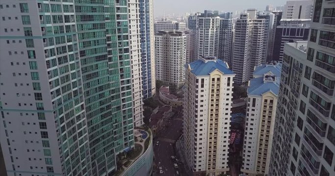 Aerial flight through high rise buildings. Development area. Urban city view. Drone, 4K. 

Frame rate: 23.98
Video Codec: ProRes 422HQ
Bonifacio Global City, BGC
Manila, Philippines