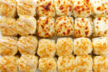 Baked rolls on white background top view