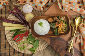Fototapeta na wymiar Crispy pork belly with Thai basil. Classic Thai dish