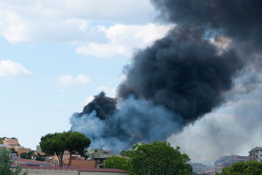 Black smoke caused by a fire in the Centocelle district of Rome
