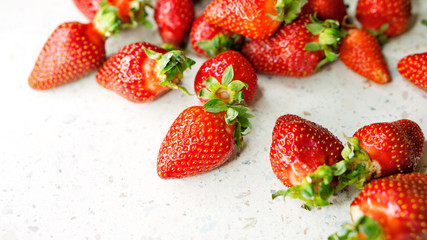 Freshly picked strawberries from the home garden. Natural organic food production. Heap of summer red berries. Homegrown, gardening and agriculture concept. Close up. Soft focus