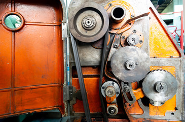 close up modul gear of  lathe machine paint orange background in factory