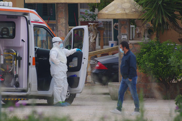  Home care operating unit with anti-Covid-19 or coronavirus protection at the service of a patient,...