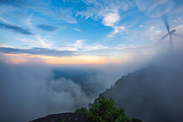 Windmill in the rainy season in the missing mountain in Heyuan, Guangdong, China