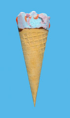 side view marshmallow and raspberry flavor ice cream cone with a small bite on blue background