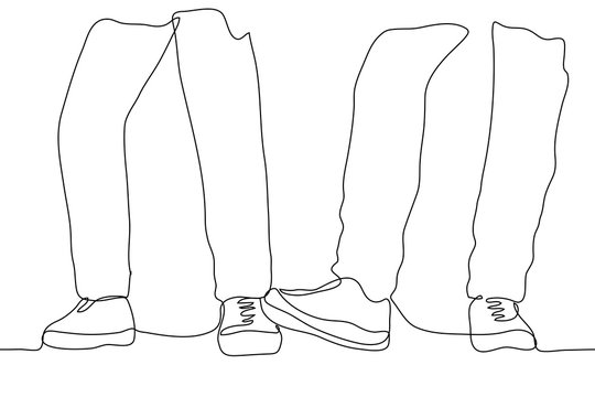 silhouette of the legs of two people in trousers, one person stepping on the other foot. The concept of playing between friends, rivalry, meanness, business competition, stepping on someone's foot,