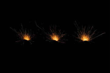 three spark fire on black background