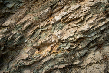 A close up of the surface of the grey stone.Close-up of a rocky cliff. Stones. Background.