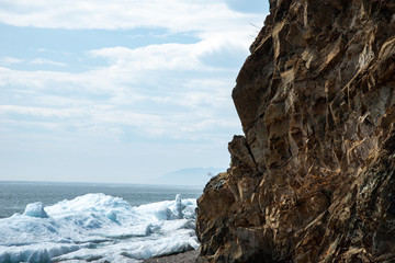Natural background. Change of seasons.Baikal Lake in May morning.Spring landscape.The view from the...
