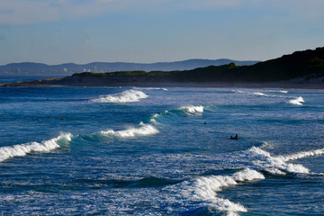 Surfers at Norah Head on the Central Coast of New South Wales