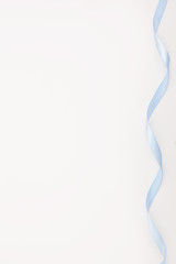 isolated blue satin silk atlas ribbon on white background