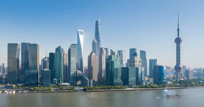 time lapse of beautiful shanghai cityscape, pudong skyline and busy huangpu river , China