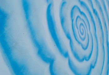 Fototapeta na wymiar concrete paint blue spiral background