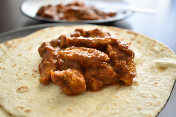 Chicken curry with tacos naan bread.  Selective focus. 