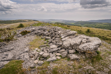 Whitbarrow is a hill in Cumbria, England. Designated a biological Site of Special Scientific Interest and national nature reserve, it forms part of the Morecambe Bay Pavements