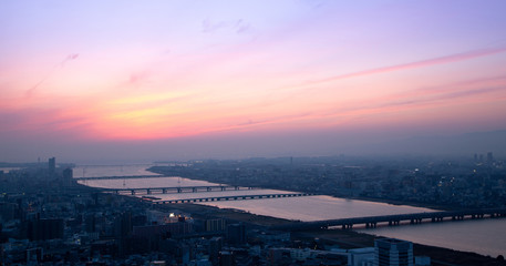 Naklejka premium Beautiful Sunset sky over Osaka city and river aerial view, cityscape