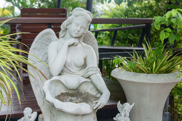 woman Statue adorn in garden