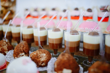 Delicious varied desserts at the wedding table.