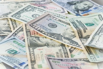 Background of many american diferent dollar banknotes © Iliya Mitsk