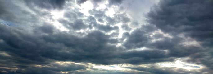 landscape photo of the sky covered with rain clouds