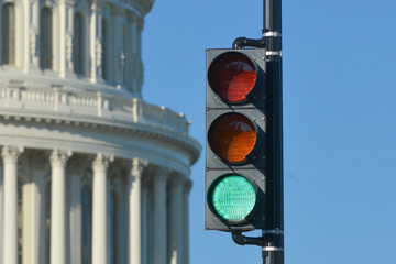 Green traffic light in front of the U.S. Capitol Building represents an positive decision