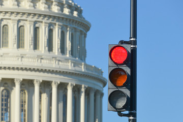 Red traffic light in front of the U.S. Capitol Building representing a negative opinion - Washington D.C. United States of America
