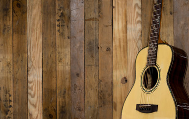 Fototapeta premium Acoustic guitar on wood floors