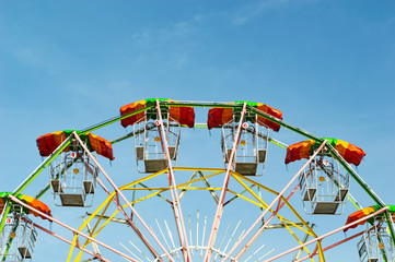 Ferris wheel vintage blue sky background
