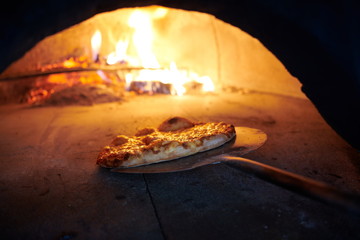 rustic pizza in wood fired oven