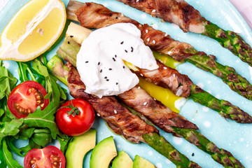 Close up Asparagus and fried bacon and boiled eggs. Food recipe background. top view