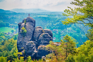 Splendid morning view of sandstone cliff in Saxony Switzerland. Colorful summer scene rocky...