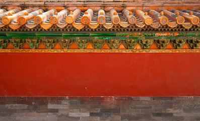 Chinese traditional red wall with blue sky. Minimal background.
