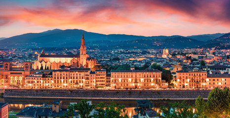 Fototapeta na wymiar Panoramic summer cityscape of Florence with Cathedral of Santa Maria del Fiore (Duomo) and Basilica of Santa Croce. Breathtaking sunset in Tuscany, Italy, Europe. Traveling concept background.