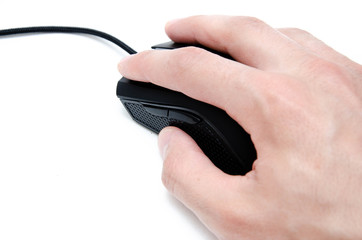 A male hand holds, controls, presses a wired black gaming mouse on a white background. The mouse is...