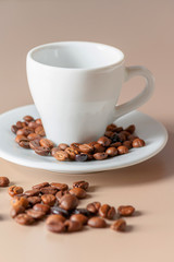 Roasted coffee beans and cup with copyspace. Roasted coffee beans of the morning mood.