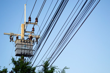Electric tranformer on the eletric pole tower with blue sky