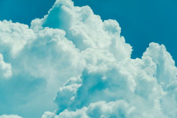 Beautiful puffy clouds against pastel blue skies. 
