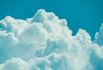 Beautiful puffy clouds against pastel blue skies. 