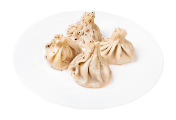 georgian cuisine - portion of peppered khinkali on white plate isolated on white background
