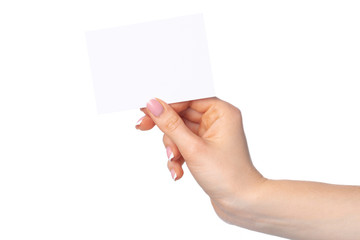 Obraz premium Woman's hand with blank white business card isolated on white