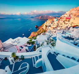 Captivating morning view of Santorini island. Exciting summer scene of famous Greek resort Oia, Greece, Europe. Fabulous Mediterranean seascape. Traveling concept background.
