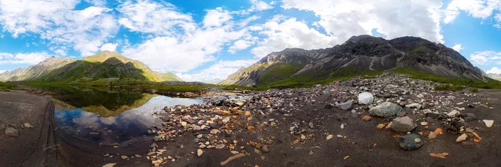 Foto op Canvas Transparent clear water of a mountain lake under a blue sky in the clouds. sand beach. cylindrical panorama 360 © Baikal360
