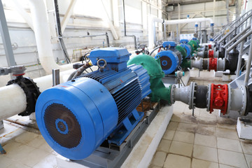 Modern pumping station at the water intake. Pipes, electric motors, pumping units.