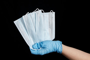 Face masks, disposable medical sanitary surgical masks in hand